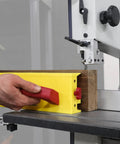 Person using GrabberPRO LITE Push Block For Table Saws And Router Tables With Adjustable One Inch Leg on wood piece