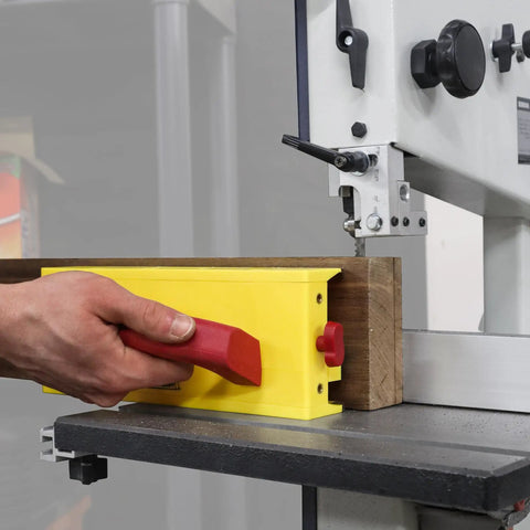 Person using GrabberPRO LITE Push Block For Table Saws And Router Tables With Adjustable One Inch Leg on wood piece