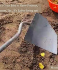 Workhorse Triangle Hoe Garden Tool With Hardened Steel Plow Head For Digging Weeding Planting Ridging And Soil Leveling Built For Manuring And Landscaping Bronze shown in soil.