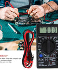 Person using Portable Digital Multimeter with LCD Display for DIYers and Pros in electronic testing setup