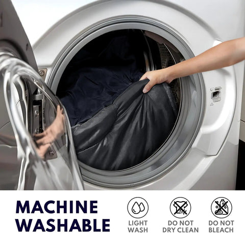 Person placing XXL Winter Sleeping Bag For Adults With Draft Collar And Zipper Guard into washing machine