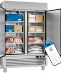 Heavy Duty Commercial Upright Freezer With Kickass WiFi Setup App Slick Temp Control LED Interior Lighting Solid Stainless Steel 49 Cubic Foot filled with meats and seafood.