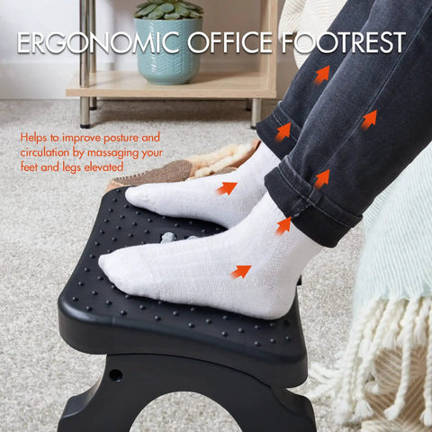 Under Desk Footrest With Massage Rollers, Comfy Ergonomic Foot Stool For Home Office with feet resting on black surface