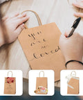 Person writing on a Brown Kraft Gift Bag With Handles 5.25 By 3.75 By 8 Inch Heavy Duty 100G Bulk Pack For Small Biz Retail
