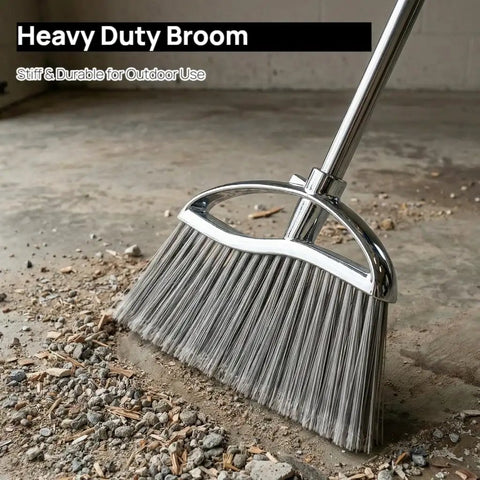 Heavy Duty Angle Broom Featuring Rigid Bristles And An Extended Handle That Smashes Through Stubborn Dirt And Leaves On Patios Garages And Commercial Floors Like Butter on a dirt floor.