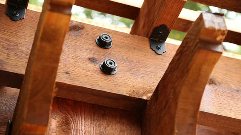 Close-up of Ten Pack 2 Inch Decorative Angle Rafter Clips With Sunset Powder Coated Finish For Pergola Deck And Fence, showing installation on wood.