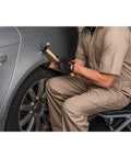 Mechanic using 7-Piece Auto Body Repair Kit With Carbon Steel Hammer Heads And Dollies On Wood Handles for sheet metal work