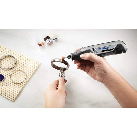 Ultra Compact Four Volt Cordless Rotary Tool Featuring Variable Speed And No Sweat Accessory Swaps For Grab And Go Crafting, used on metal ring.