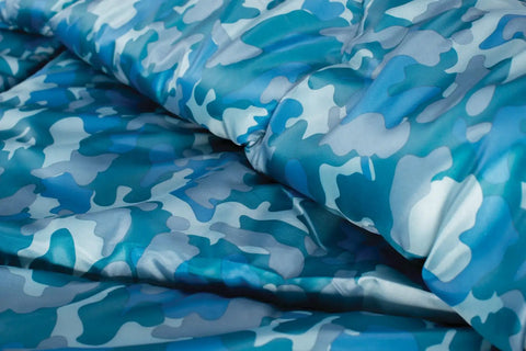 Blue camo fabric of Kids 45F Sleeping Bag For Kids Up To 5 Ft 5 In Tall, Lightweight Warm Sleep Sack For Indoor Outdoor Use
