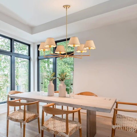 39 Inch Boho Rattan Chandelier With Six Warm Bulbs Hits Different On Your Kitchen Island Dining Table Or Living Room Ceiling Using Real Natural Weave And Seamless Brass Rods Built Big Time Safe Through UL Certification above a dining table with wooden chairs and decorative vases.