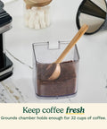 Electric Burr Coffee Grinder With One Touch Automation And Eighteen Position Grinding Dial For Hella Precise Fresh Beans Plus Super Fast Cleanup And Adjustable Cup Settings For Everyday Barista Vibes grounds container filled with coffee grounds and wooden scoop.