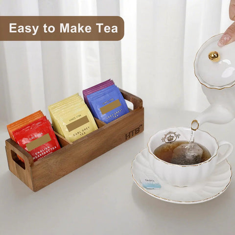 Three Compartment Wooden Tea Bag Box With Handle Acacia Wood Caddy For Tea Bags Sugar Packets Creamers And More next to teapot and cup