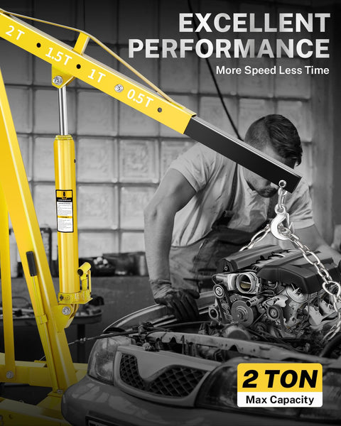Heavy Duty 2 Ton Hydraulic Engine Hoist Crane Folding Cherry Picker With 4400 Lbs Capacity and Six Locking Casters in use lifting an engine