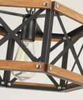 Kickass 14 Inch Black Farmhouse Pendant Light With Plug In Dimmable Switch And Adjustable Woven Cord For Kitchen Island Or Dining Room Heavy Oak Wood And Metal Cage Fixture Giving Major Rustic Vibes That Goes Hard On Sloped Ceilings close-up of black metal cage with oak wood details and exposed bulb.
