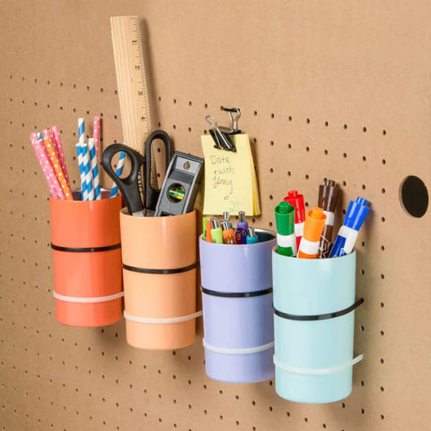 Colorful desk organizers holding stationery on a pegboard wall with Heavy Duty 12 Inch Black Cable Ties Pack Of 100 For Outdoor Use With 60 Pound Tensile Strength Self Locking Fasteners That Stay Locked In Place Tough As Nails For Outdoor Ready Handling And Reliable Performance