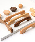 Wooden cabinet handles and knobs in various finishes, including Two Solid Wood Dark Walnut Cabinet Pulls 126mm Overall Length 96mm Center to Center Mounting 12mm Width Durable Simple Modern Design for Cabinets Cupboards Doors Drawers Dressers and Shoe Cabinets with Smooth Surface Finish, displayed on a white surface.