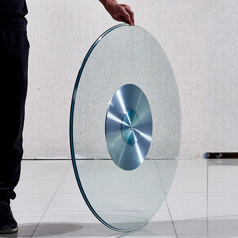 Person holding Tempered Glass Lazy Susan Turntable For Dining Tables A Game Changer Glass Lazy Susan For Family Dinners And Birthday Parties Smooth Rotation Explosion Proof High Temp Resistant Easy To Clean Safe Edges And Versatile Table Accessory