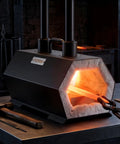 Portable Two Burner Propane Forge For Blacksmithing And Knife Making, Reaches 2600 F, glowing with metal inside