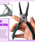 Hand holding tool with visible spring, related to 240 Piece Stainless Steel Compression Springs Kit In 15 Sizes For Home And Workshop Repairs