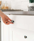 Hand installing 4 Piece Square Drawer Pulls And Cabinet Knobs Set With Dope Colorful Daisy Tulip Floral Pattern for cabinets.