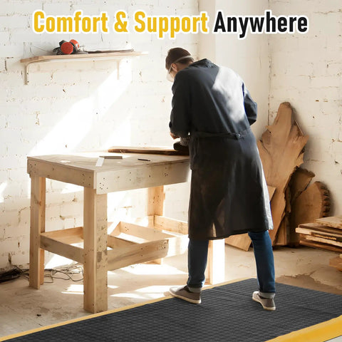 Person working on wooden table with Extra Thick 3 By 7 Ft Anti Fatigue Floor Mat For Standing Tasks In The Shop Or Garage Ergonomic Comfort.