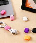 Multi Pack Cable Clips Organizer For Travel And Desk Use Cord Management Clips displayed on desk with laptop and cable