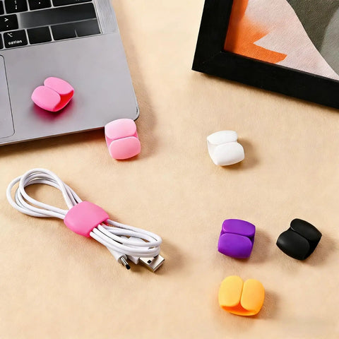 Multi Pack Cable Clips Organizer For Travel And Desk Use Cord Management Clips displayed on desk with laptop and cable