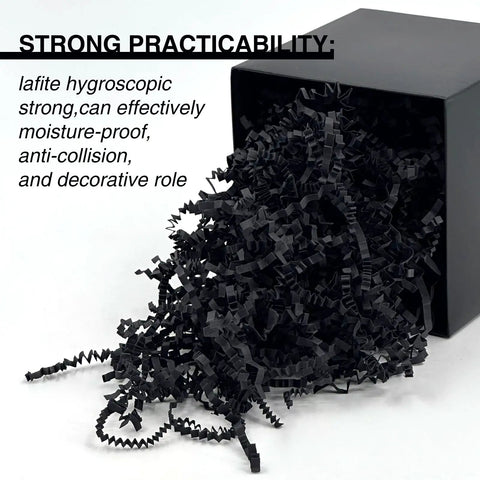 Black crinkle cut paper shred filler spilling from black box, shows One Pound Crinkle Cut Paper Shred Filler For Gift Boxes Baskets And Bags Perfect For Holidays Parties Sub Boxes And Mailers Eco Friendly Recyclable Black Shredded Paper Packaging Filler