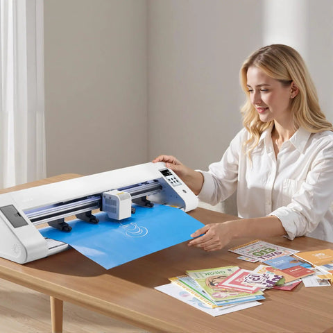 Person using Vinyl Cutter With Automatic Edge Detection And Dual Blade System For Precise DIY Crafts on a table with design sheets.