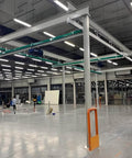 Beefy 8 Wheel Beam Trolley Assembly For Unistrut 1-5/8 Inch Wide Taller Channel Track in warehouse setting