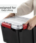 Person lifting a five gallon black waterproof storage tote with red clips, part of a Six Pack Five Gallon Waterproof Storage Totes IP68 Submersible Plastic Bins With Airtight Silicone Seals Rock Solid Stackable Dry Boxes Built Tough To Handle Any Wet Job BPA Free.