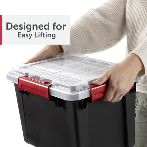 Person lifting a five gallon black waterproof storage tote with red clips, part of a Six Pack Five Gallon Waterproof Storage Totes IP68 Submersible Plastic Bins With Airtight Silicone Seals Rock Solid Stackable Dry Boxes Built Tough To Handle Any Wet Job BPA Free.