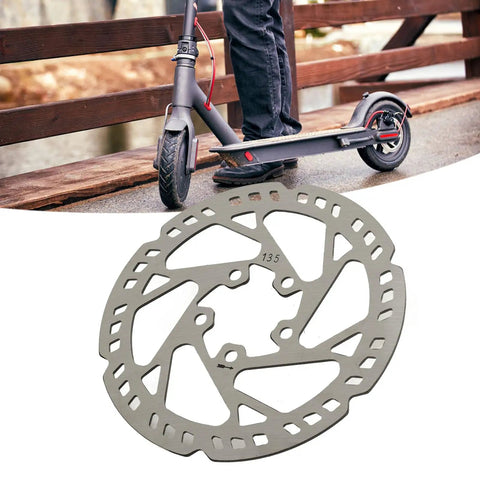 135mm Electric Scooter Brake Disc Replacement Stainless Steel Rotor Enhanced Heat Dissipation Smoother Braking Easy Install for Quick Maintenance and Reliable Ride shown with scooter