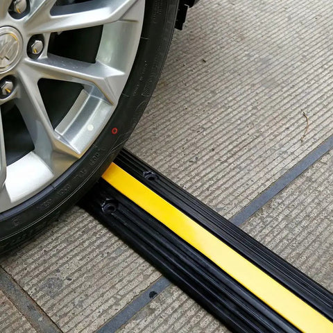 Car wheel on Ridiculously Tough Rubber Cable Ramp 1 Channel Cord Cover For Wires And Hoses, Holds Up To 22000 Lbs, asphalt use