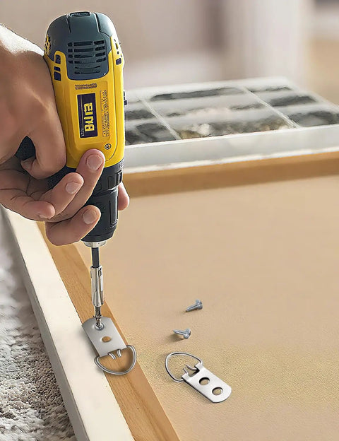 Installation of 140 Piece Rock Solid D Ring Picture Hanger Screw Kit With Single And Double Hole D Rings for secure hanging.