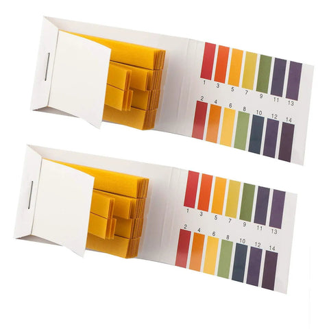 Two open packs of PH Indicator Strips Short Range Test Paper Litmus Strips For Home Use with pH 1-14 color chart