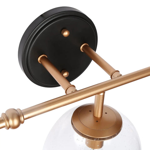 Black And Gold Three Light Vanity Light Fixture With Seeded Glass Shades And Black Backplate For Modern Bathrooms Over Vanity Mirror Dope Glam Glow That Elevates Your Powder Room And Guest Bath Vibe In A Modern Home close-up of backplate and arm design