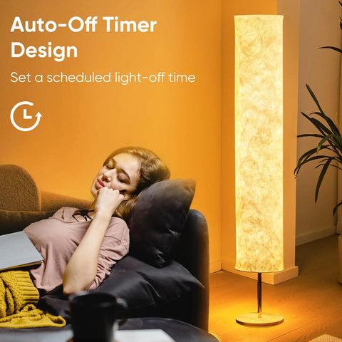 Woman relaxing with 58 Inch Modern Floor Lamp With Tyvek Shade Warm White LED 3000K Slim Standing Light for living room with auto-off timer