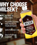 Hand holding a bottle of Antique Restoration Wood Polish And Cleaner with clear label featuring benefits and usage.