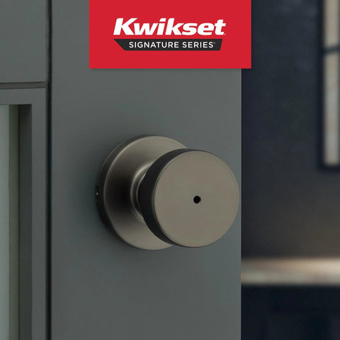 Kwikset Pismo interior round privacy doorknob with lock in gunmetal finish, close-up view