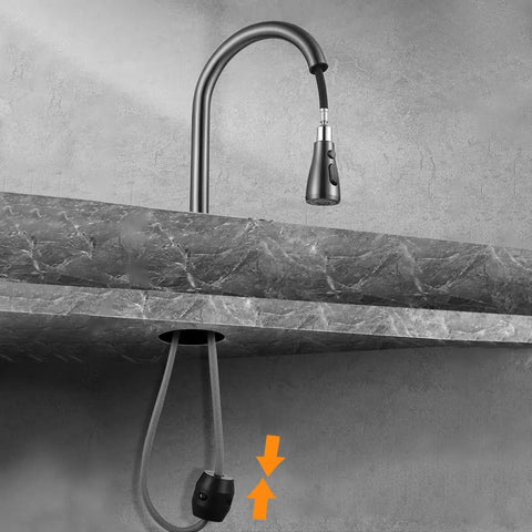 Universal Pull Down Faucet Hose Weight Ball For Kitchen Sink Sprayers And Bathroom Basins Heavy Duty Gravity Replacement, shown attached to a kitchen faucet.