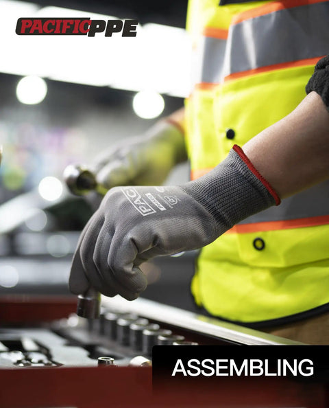 Person wearing PU Coated Touchscreen Work Gloves 18 Pair Pack For Men And Women, handling tools in assembly work.