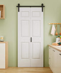 32x84 Inch Bi Fold Barn Door Set With Six Raised Panels, Paintable White Primed Finish, installed in a kitchen