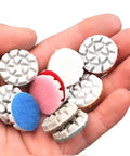 Hand holding Mini Diamond Polishing Pad Set 1 Inch With 14 Grits From 50 To 10000 Water Sanding Discs