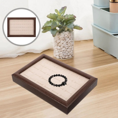 Crafted From Warm Wood This Super Chic 30 Compartment Jewelry Organizer stores rings necklaces and bracelets straight up in style with a black bracelet.