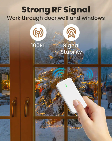 Hand holding Remote Control Outlet Switch With Wall Mount, Compact Plug-In Power Control For Lamps And Home Appliances, 300 Feet RF Range, Detachable Wireless Remote, Two-In-One Outlet With Spare Socket, FCC Listed in front of a window during Christmas.