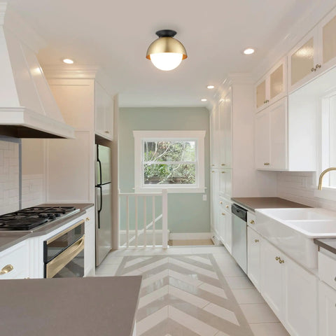 Loft Style Matte Brass Flush Mount Light With Black Canopy And Frosted Glass Shade in a modern kitchen ceiling