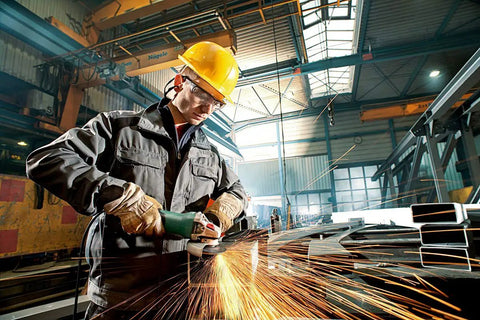 Worker using Pro Grade 6-Inch Angle Grinder With 10,000 RPM And 12 Amp Motor, Non-Locking Paddle Switch, Built-In Brake in a workshop