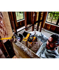 Person using Atomic 20V Max One-Handed Cordless Reciprocating Saw Tool Only With Brushless Motor in tight space