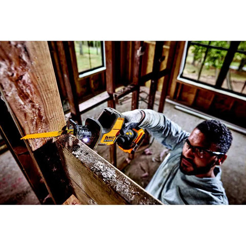 Person using Atomic 20V Max One-Handed Cordless Reciprocating Saw Tool Only With Brushless Motor in tight space